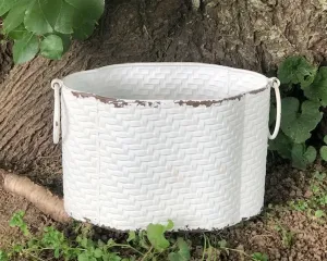 Distressed oval wicker decorative container