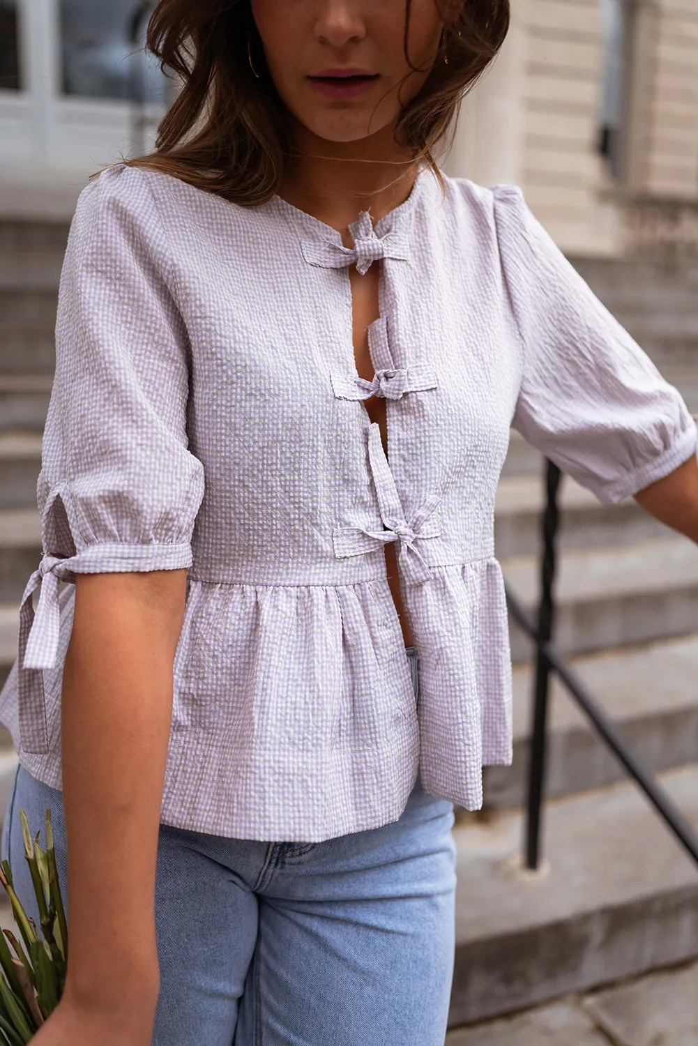 Orchid Petal Checkered Lace-Up Half Sleeve Peplum Blouse