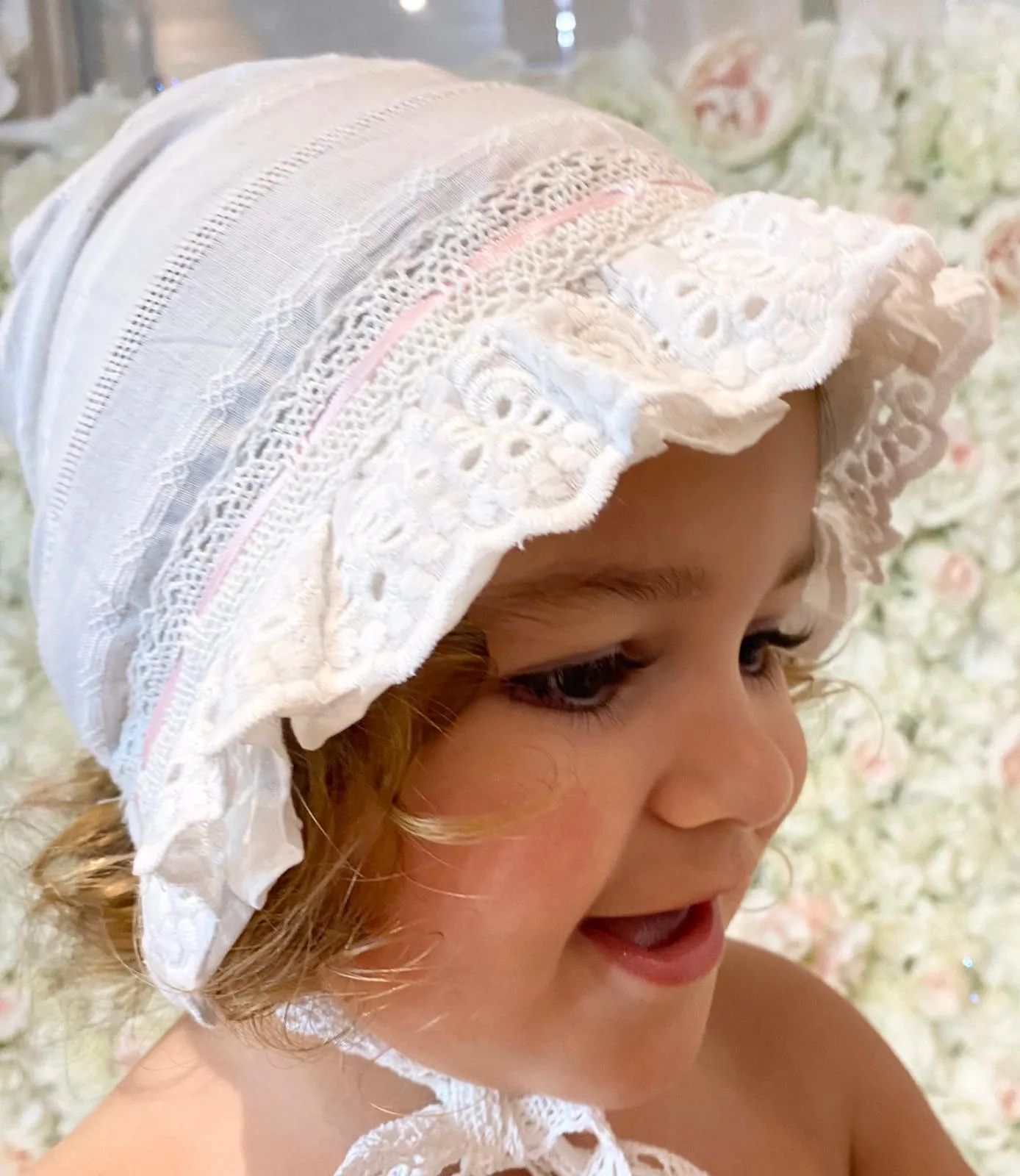 Pink and white lace detailed bonnet
