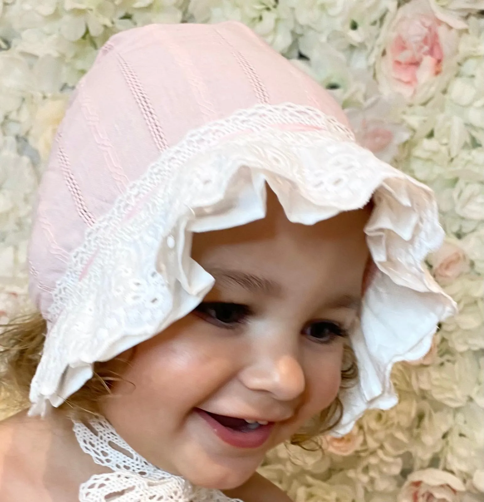 Pink and white lace detailed bonnet