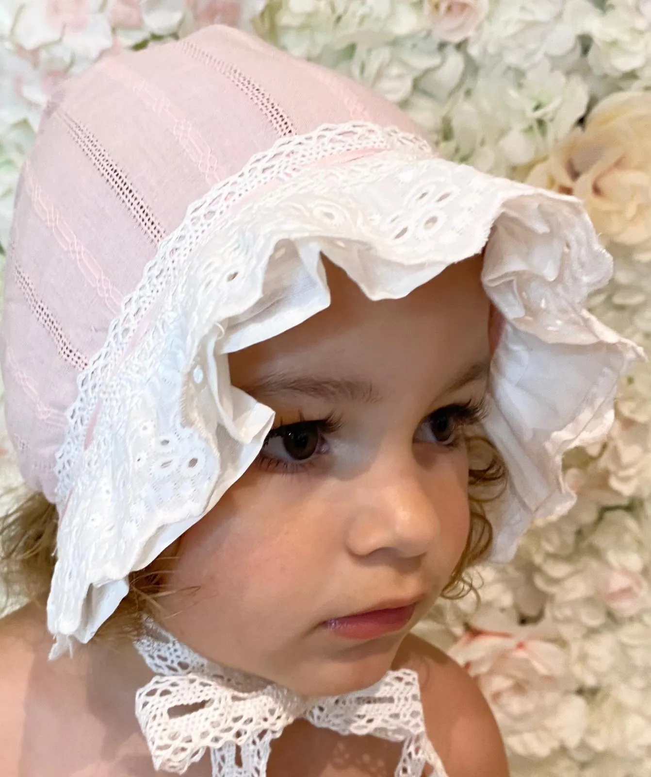 Pink and white lace detailed bonnet