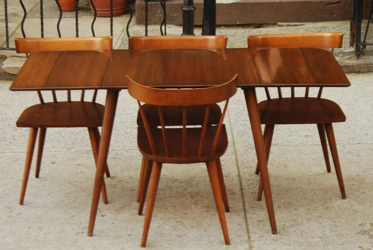 SOLD -- PAUL MCCOBB COMPACT DINING SET WITH TWO LEAVES AND FOUR CHAIRS